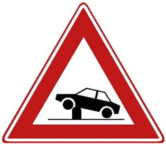 Verkeersbord J39: Waarschuwing voor elektrische in- en uitschuifbare paal in de rijbaan (poller) waarmee toegankelijkheid van straten en gebieden kan worden geregeld.